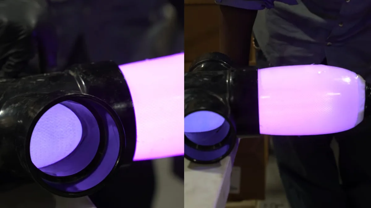 Purple dye test visible inside a pool plumbing pipe during leak investigation