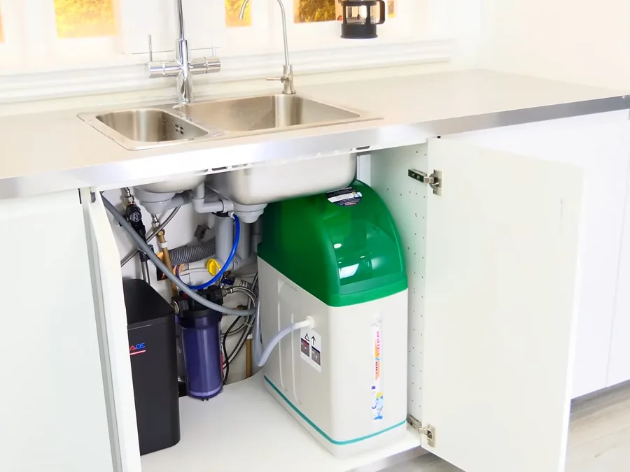 Reverse osmosis filtration system installed below a kitchen sink