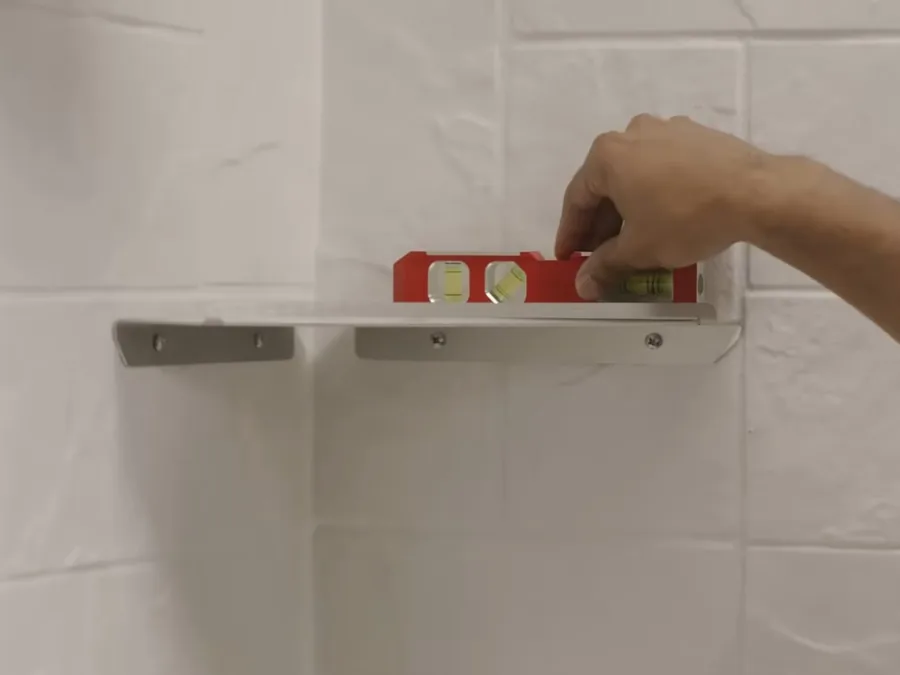 Shower wall rough-in area with niche and level during installation