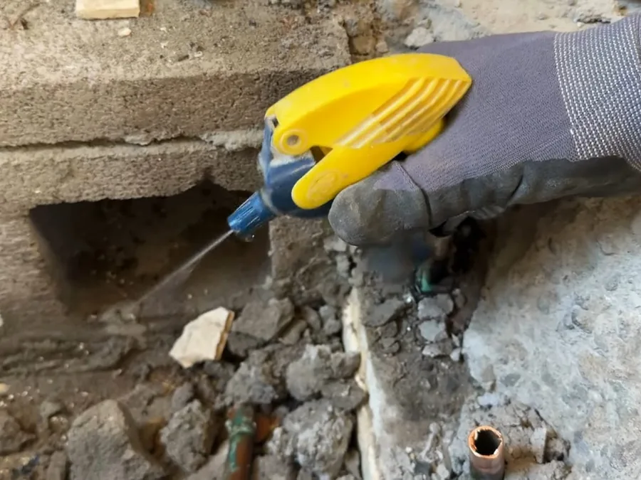 Open concrete slab access around pipes during leak detection and repair