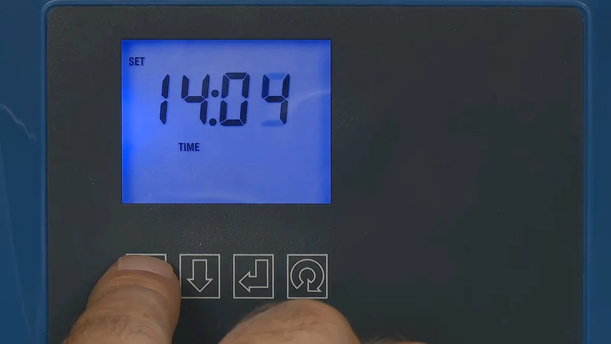 Open water softener brine tank showing salt level during maintenance