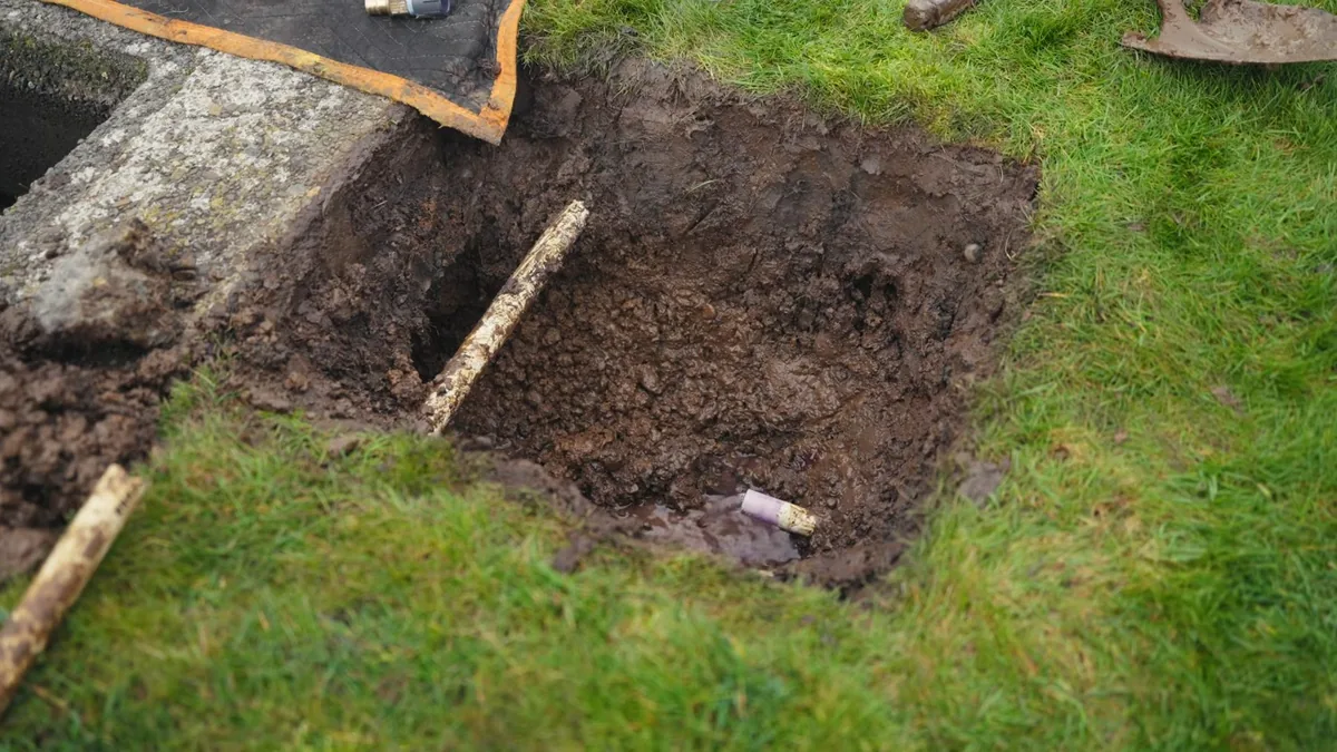 Yard excavation for underground pipe repair in a Sierra Madre foothill property